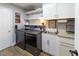 A functional laundry room with modern washer and dryer, built-in sink and plenty of cabinet space at 11050 Midnight Pass, Fishers, IN 46037