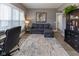 Well-lit office space featuring a comfortable seating area, providing a functional and inviting workspace at 11050 Midnight Pass, Fishers, IN 46037