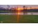 Sunset view overlooking the pond, creating a peaceful backyard at 11050 Midnight Pass, Fishers, IN 46037