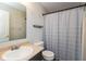 Cozy bathroom features a single sink vanity, toilet, and shower with curtain at 1167 Dark Star Ct, New Whiteland, IN 46184