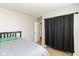 Bedroom features a black headboard, neutral walls, and carpet, with closet space at 1167 Dark Star Ct, New Whiteland, IN 46184