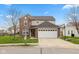 Charming two-story home featuring a brick facade, attached two car garage and well maintained front yard at 1167 Dark Star Ct, New Whiteland, IN 46184