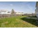 Well-maintained backyard featuring a grassy lawn, privacy fence, and space for outdoor activities at 12344 Bearsdale Dr, Indianapolis, IN 46235