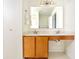 Bright bathroom featuring a double sink vanity and a large mirror at 12344 Bearsdale Dr, Indianapolis, IN 46235