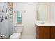 Bathroom featuring a vanity, toilet and shower with patterned curtain at 12344 Bearsdale Dr, Indianapolis, IN 46235
