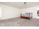 Bright bedroom with plush carpet, bright walls, bed, and access to a bathroom and closet at 12344 Bearsdale Dr, Indianapolis, IN 46235