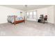 Bright bedroom with plush carpet, bright walls, bed, and a window with curtains at 12344 Bearsdale Dr, Indianapolis, IN 46235