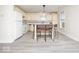 Efficient kitchen featuring white appliances, light-colored cabinetry, and a central island with seating at 12344 Bearsdale Dr, Indianapolis, IN 46235