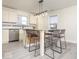 Eat-in kitchen with a center island, pendant lighting, and seating at 12344 Bearsdale Dr, Indianapolis, IN 46235