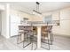 Kitchen with stainless steel appliances, light-colored cabinets, a central island with seating, and modern pendant lighting at 12344 Bearsdale Dr, Indianapolis, IN 46235
