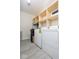 Laundry room with shelving and modern washer and dryer units at 12344 Bearsdale Dr, Indianapolis, IN 46235