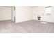 Bright living room with plush carpet and an alcove for media equipment, offering a cozy entertainment space at 12344 Bearsdale Dr, Indianapolis, IN 46235