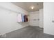 Spacious walk-in closet with gray carpet, wire shelving for storage, and good ceiling height at 12344 Bearsdale Dr, Indianapolis, IN 46235