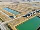 Newly developed area showing water features and completed homes in the Lone Pine Farms neighborhood at 1378 Foxtail Ln, Greenwood, IN 46143