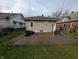Exterior view of backyard with grass and concrete patio at 1524 Ohio Ave, Anderson, IN 46016