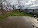 Backyard with a concrete patio and grass at 1524 Ohio Ave, Anderson, IN 46016