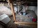 View of the basement with concrete flooring and washing machine at 1524 Ohio Ave, Anderson, IN 46016