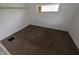 View of a small bedroom with carpeting and a window at 1524 Ohio Ave, Anderson, IN 46016