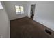 Small bedroom with carpeting, a window and white trim at 1524 Ohio Ave, Anderson, IN 46016