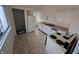 Kitchen with white cabinets, a double sink, and linoleum flooring at 1524 Ohio Ave, Anderson, IN 46016