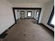 Living room with carpet and black trim around windows at 1524 Ohio Ave, Anderson, IN 46016