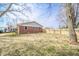 Spacious backyard with a brick exterior, a privacy fence and mature trees at 16371 State Road 38 E, Noblesville, IN 46060
