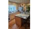 Updated kitchen featuring granite countertops, stainless steel refrigerator, and a large island with barstool seating at 16371 State Road 38 E, Noblesville, IN 46060