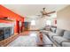 Bright living room featuring a cozy fireplace, neutral-toned furniture, and natural light at 16371 State Road 38 E, Noblesville, IN 46060