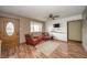 Cozy living room with hardwood floors, two chairs, and a window for natural light at 16371 State Road 38 E, Noblesville, IN 46060