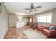 Inviting living room features hardwood floors, neutral paint, and comfortable seating, perfect for relaxing or entertaining at 16371 State Road 38 E, Noblesville, IN 46060