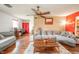 Bright living room area with hardwood floors, neutral paint and comfortable seating with natural light at 16371 State Road 38 E, Noblesville, IN 46060