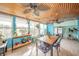 Bright sunroom with tongue and groove ceilings, stylish furnishings, and lots of natural light at 16371 State Road 38 E, Noblesville, IN 46060