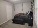 This bedroom has a large decorative bed, neutral walls, and a white door at 1806 Asbury St, Indianapolis, IN 46203