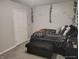 This bedroom has a large decorative bed, neutral walls, and a white door at 1806 Asbury St, Indianapolis, IN 46203