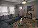 Cozy living room with modern decor, gray sectional sofa, and a glass coffee table at 1806 Asbury St, Indianapolis, IN 46203
