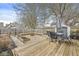 Charming backyard with deck, gravel, fire pit area, storage shed and fence at 2006 Lexington Ave, Indianapolis, IN 46203