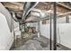 Unfinished basement with exposed ductwork and concrete flooring at 2006 Lexington Ave, Indianapolis, IN 46203