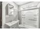 Bathroom features white vanity, toilet and shower with a glass enclosure at 2006 Lexington Ave, Indianapolis, IN 46203