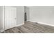 Neutral bedroom features wood-look floors and a white door at 2006 Lexington Ave, Indianapolis, IN 46203