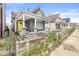 Home with a gray exterior, inviting front porch, and well-maintained yard at 2006 Lexington Ave, Indianapolis, IN 46203