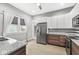 This kitchen features stainless appliances, granite countertops and tile backsplash at 2006 Lexington Ave, Indianapolis, IN 46203