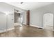 Open-concept living room featuring hardwood floors and brick details at 2006 Lexington Ave, Indianapolis, IN 46203