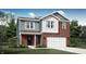 Charming two-story home with red brick and light blue siding, a covered porch, and a two-car garage at 2220 Foothill Dr, Greenfield, IN 46140