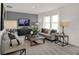 Modern living room features contemporary decor, neutral tones, and a large window at 2220 Foothill Dr, Greenfield, IN 46140