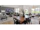 Bright, open-concept living and dining area with modern furnishings and hardwood flooring at 2220 Foothill Dr, Greenfield, IN 46140