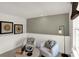 Bright and cozy loft area featuring neutral tones, comfortable seating, and natural light at 2220 Foothill Dr, Greenfield, IN 46140