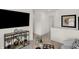 Upstairs loft area with neutral tones, a decorative display shelf, and an entertainment center at 2220 Foothill Dr, Greenfield, IN 46140
