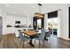 Elegant dining area featuring a wooden table, pendant lighting, and easy access to the modern kitchen at 2230 Hemlock Cir, Greenfield, IN 46140