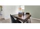 Modern home office with a sleek wooden desk, ergonomic chairs, and a bright window view at 2230 Hemlock Cir, Greenfield, IN 46140