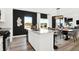 Stylish kitchen island with bar seating, adjacent to dining area and offering views of the outdoors at 2230 Hemlock Cir, Greenfield, IN 46140